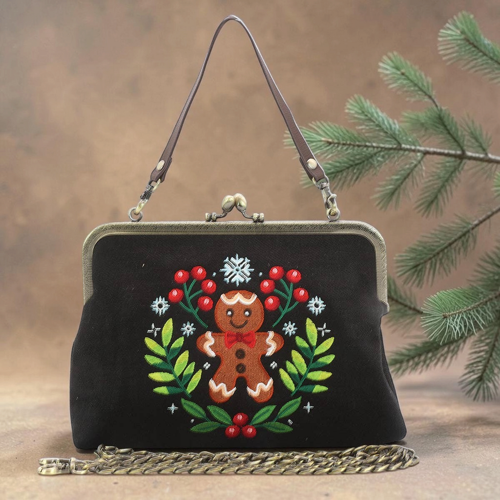 Halloween-Emporium black cotton-linen kisslock bag featuring embroidered gingerbread man, berries, and foliage