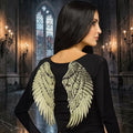 Halloween-Emporium decorative gold sequin angel wings worn by a woman against a gothic castle backdrop.