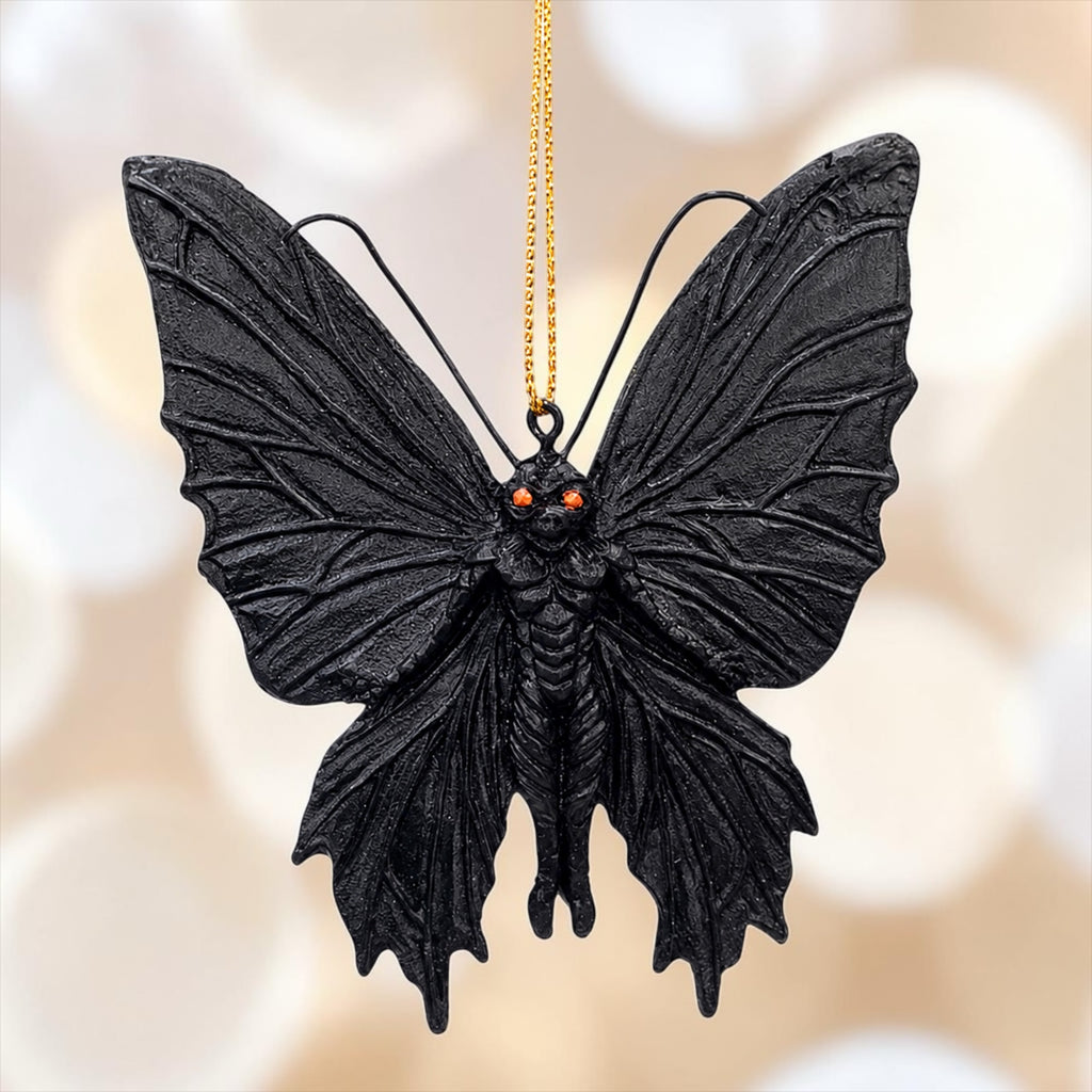 Halloween-Emporium gothic mothman hanging ornament with black textured wings and piercing red eyes.