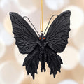 Halloween-Emporium gothic mothman hanging ornament with black textured wings and piercing red eyes.