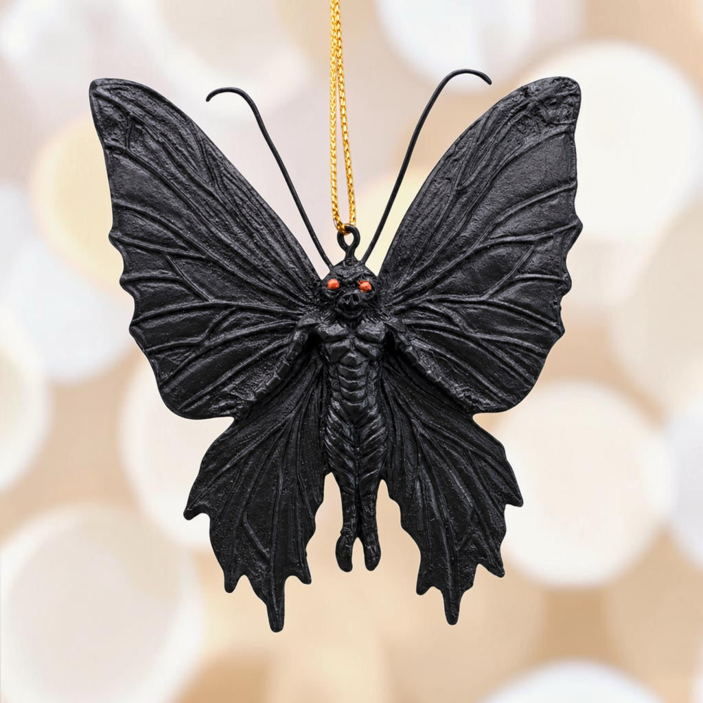 Halloween-Emporium gothic mothman hanging ornament with black textured wings and piercing orange eyes.