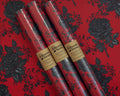 Halloween-Emporium gothic wrapping paper rolls with dark intricate rose pattern on red matte fine art paper