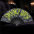 Halloween-Emporium gothic folding fan with neon yellow Spooky Bitch text and skull pattern on black fabric