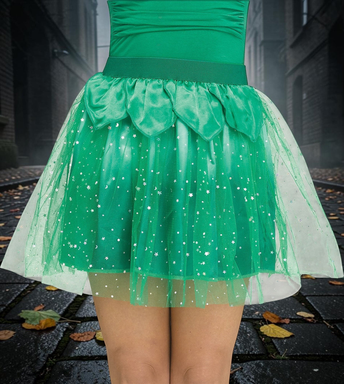 Halloween-Emporium green layered tulle fairy skirt with petal detailing and star accents on a person