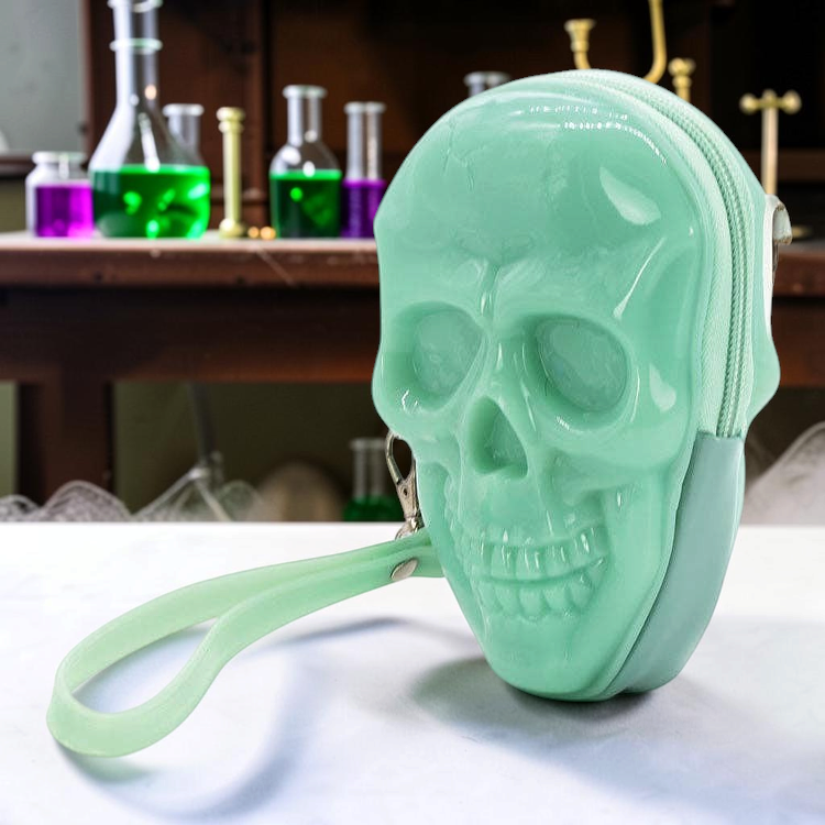 Halloween-Emporium green glow-in-the-dark skull shaped patent vinyl zippered wristlet with a wrist strap