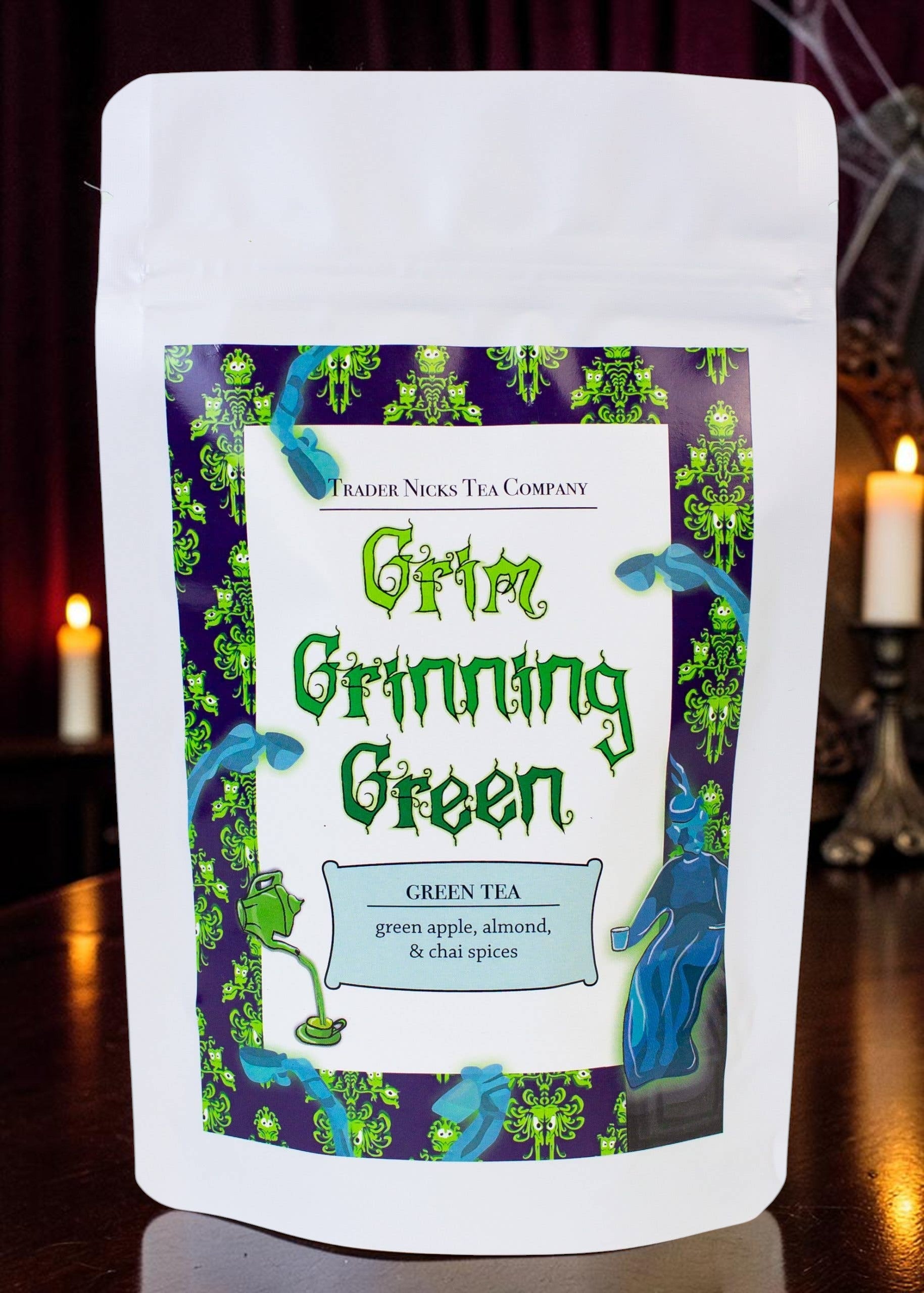Halloween-Emporium Grim Grinning Green spiced apple green tea in a white stand-up pouch with spooky ghost label art.