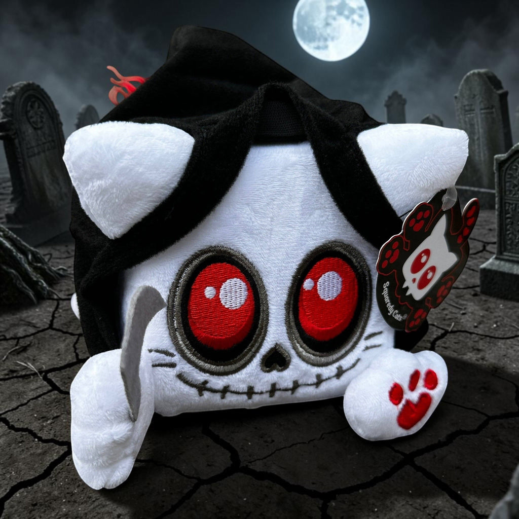 Halloween-Emporium Squaredy Cats Grim Reaper plush toy with white fur, black hooded cloak, red eyes, and scythe.
