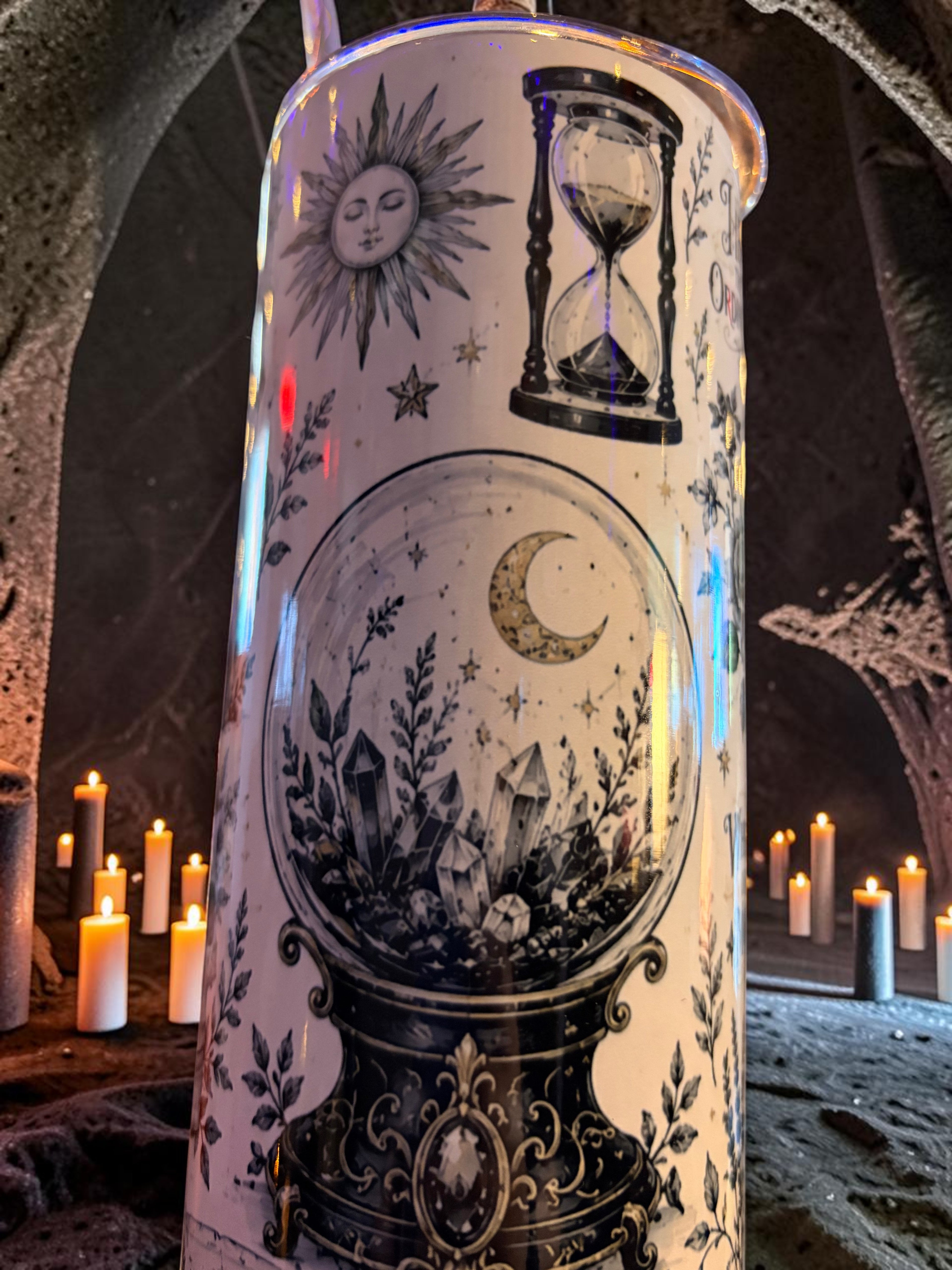 Halloween-Emporium 30oz Grimoire tumbler featuring occult illustrations of a crystal ball, hourglass, and sun.