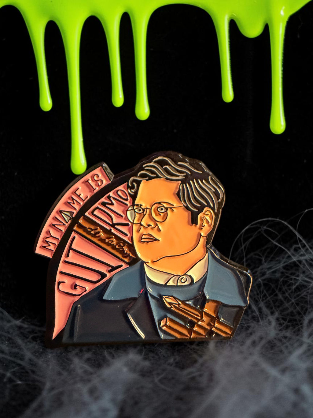 Halloween-Emporium Guillermo enamel pin from What We Do In The Shadows featuring his name and vampire hunter gear.