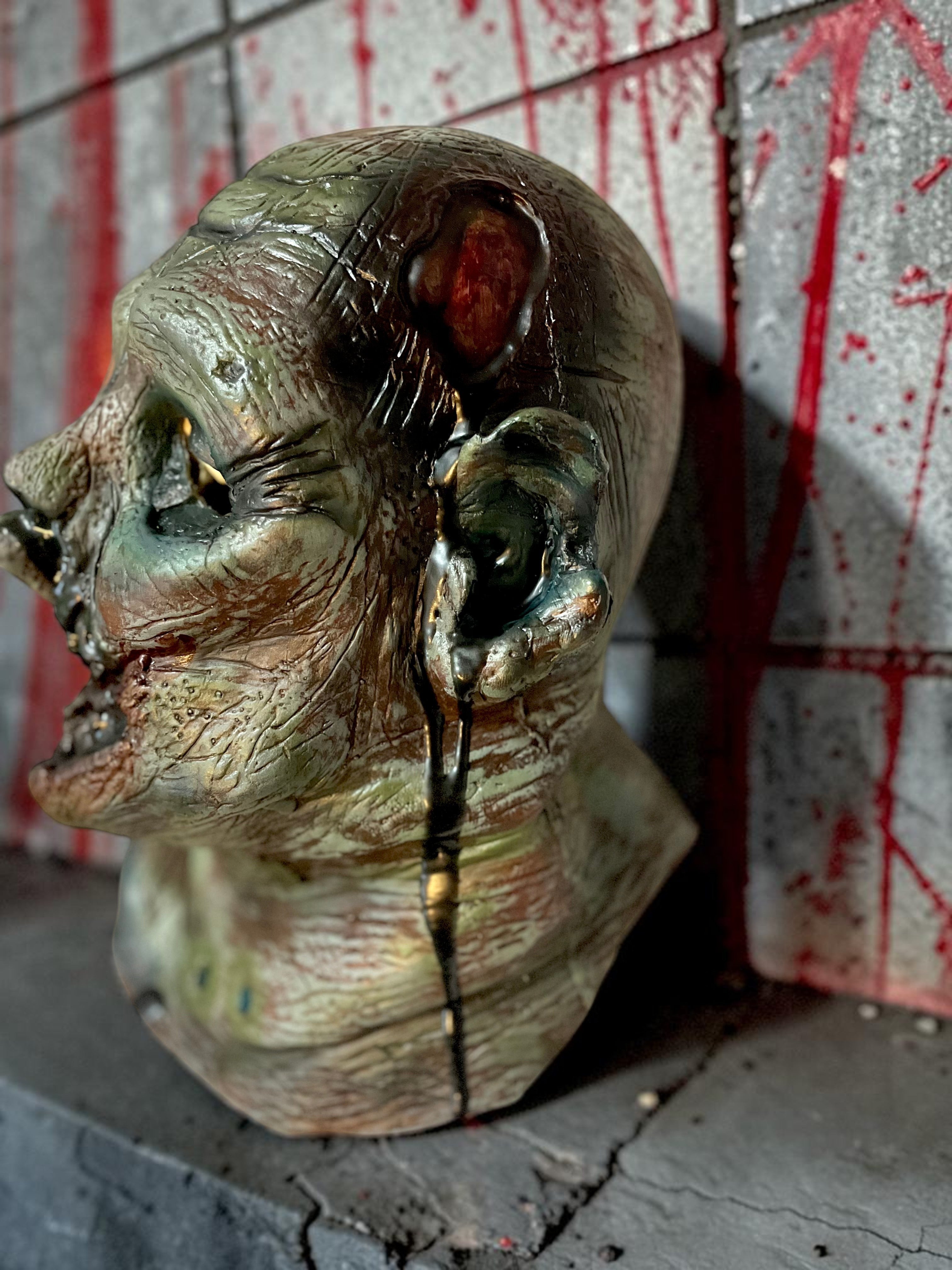 Halloween-Emporium Las Vegas Undead Gus latex zombie mask with hand-painted gore and realistic skin texture