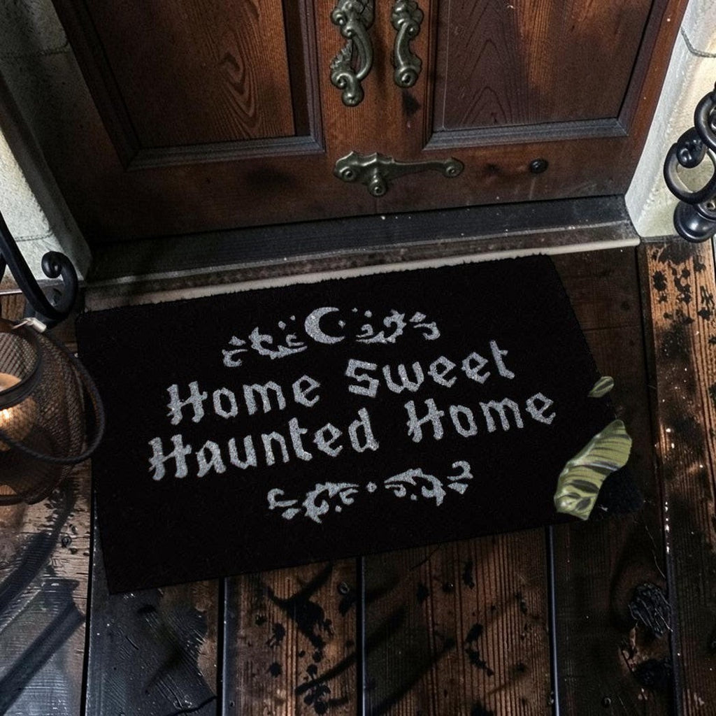 Halloween-Emporium Home Sweet Haunted Home natural grass doormat with silver text and crescent moon design.