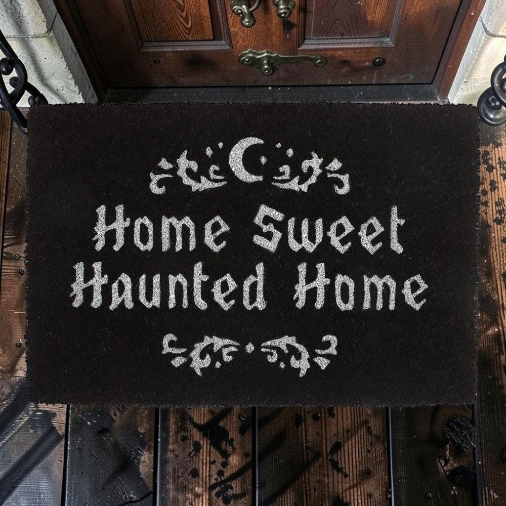 Halloween-Emporium natural grass doormat with Home Sweet Haunted Home text and crescent moon design on a porch