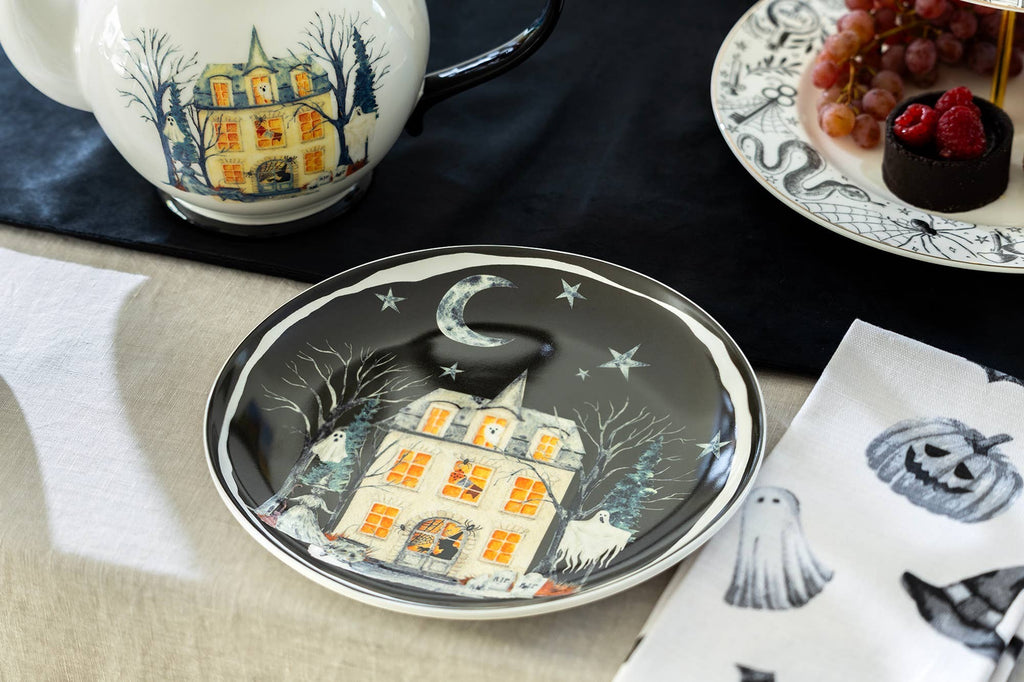 Halloween-Emporium 8.75-inch ceramic dessert plate featuring a hand-painted haunted house, crescent moon, and ghosts.
