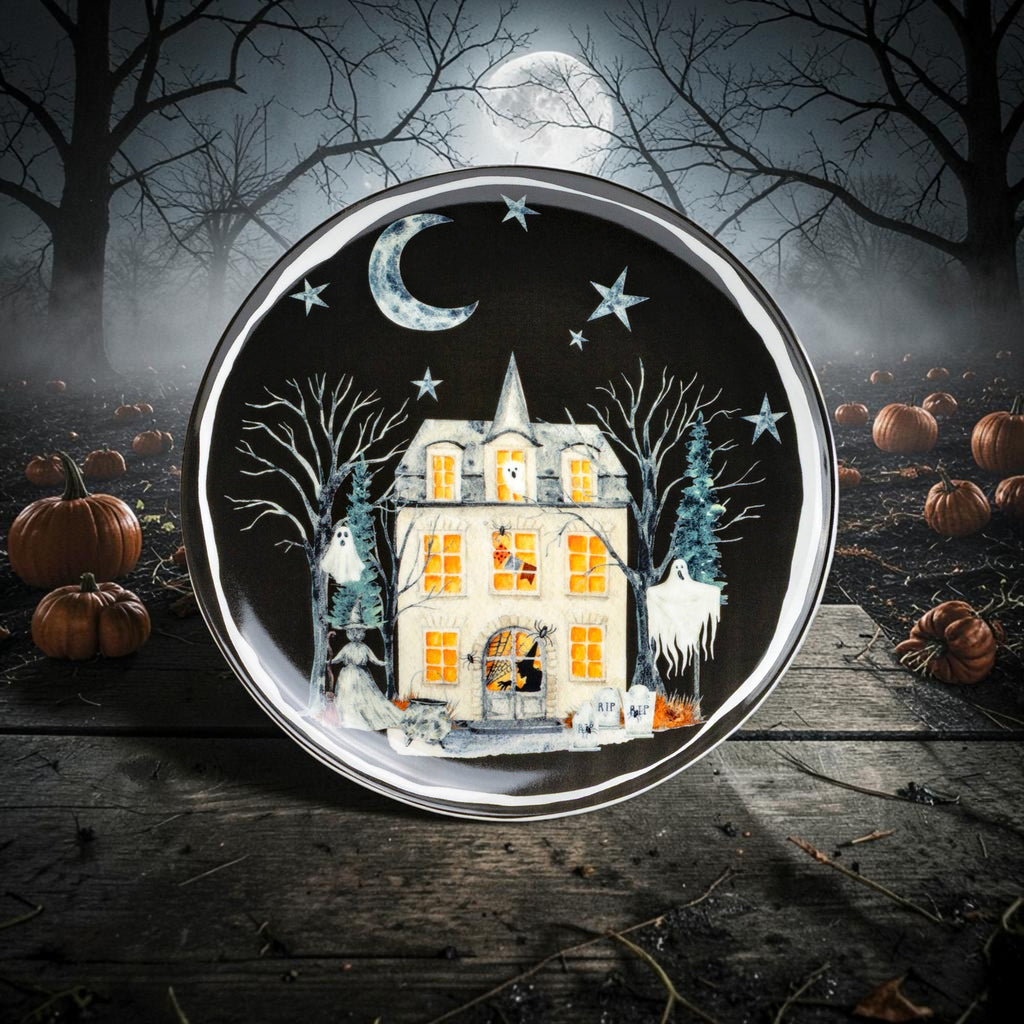Halloween-Emporium ceramic dessert plate featuring a haunted house, ghosts, and moon on a black background.