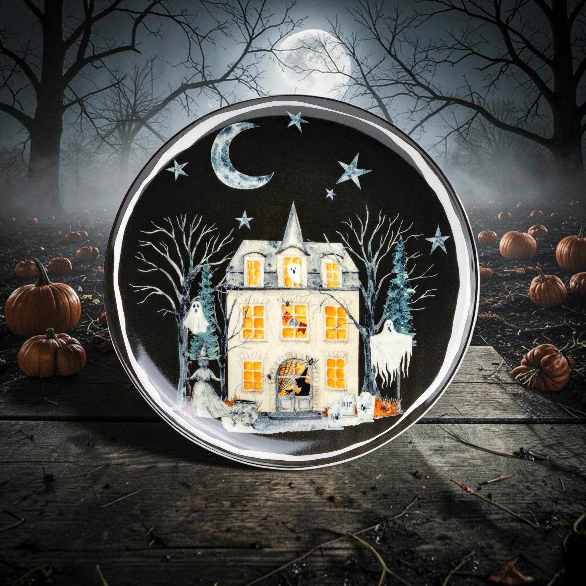 Halloween-Emporium ceramic dessert plate featuring a haunted house, ghosts, and moon on a black background.