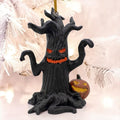 Halloween-Emporium black gnarled haunted tree ornament with a jack-o-lantern, featuring glowing orange eyes and mouth.
