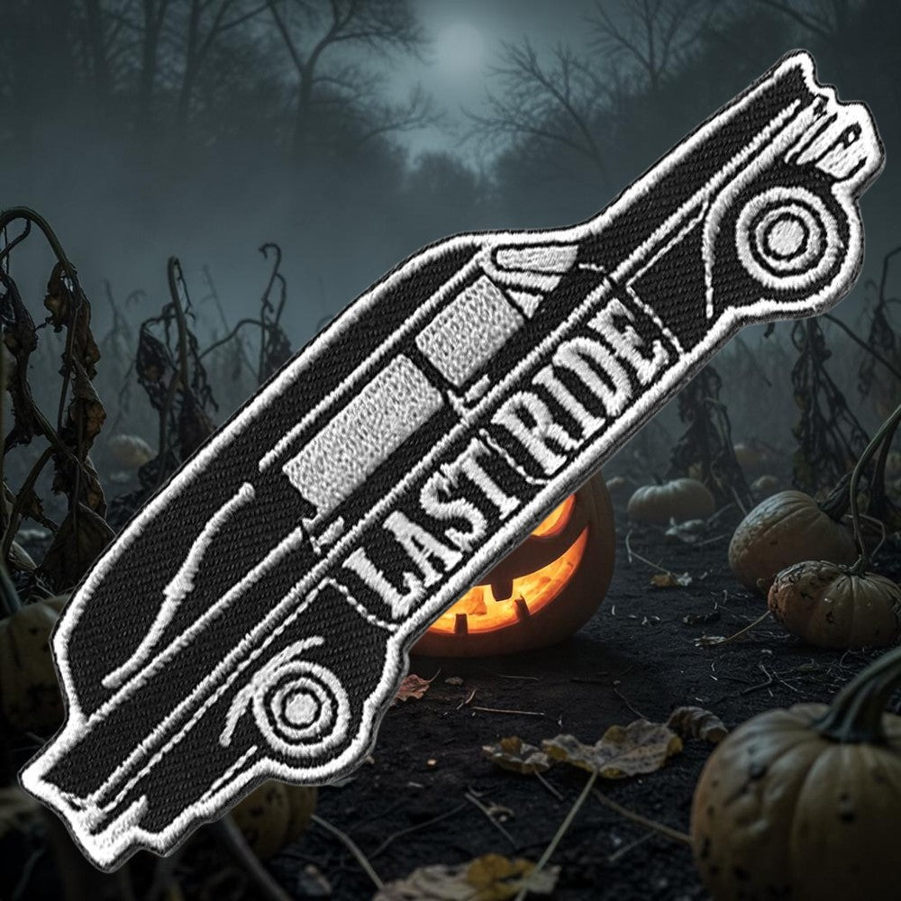 Halloween-Emporium embroidered iron-on patch featuring a black and white vintage hearse with Last Ride text.