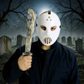 Halloween-Emporium hockey mask and distressed prop machete set worn by a person in a graveyard setting