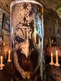 Halloween-Emporium 30oz Art tumbler featuring a dark horror clown graphic, set against a gothic candlelit background.