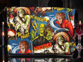 Halloween-Emporium messenger bag featuring a vibrant classic horror movie monster print on a blue background