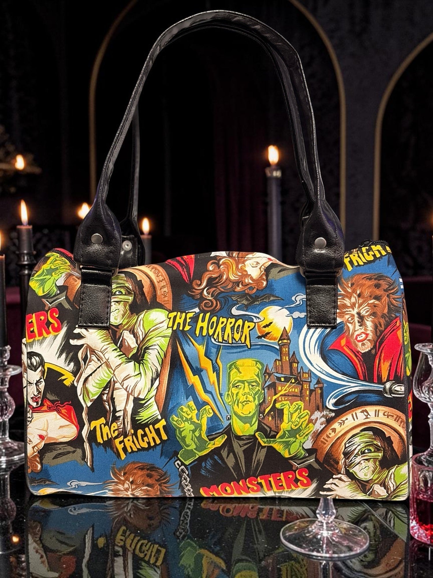 Halloween-Emporium classic horror handbag featuring vintage monster comic print with black leather-style handles