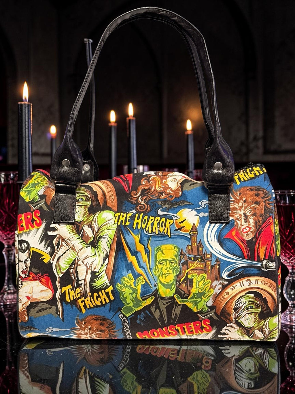 Halloween-Emporium purple handbag featuring a vintage classic horror movie monster print with black leather handles.