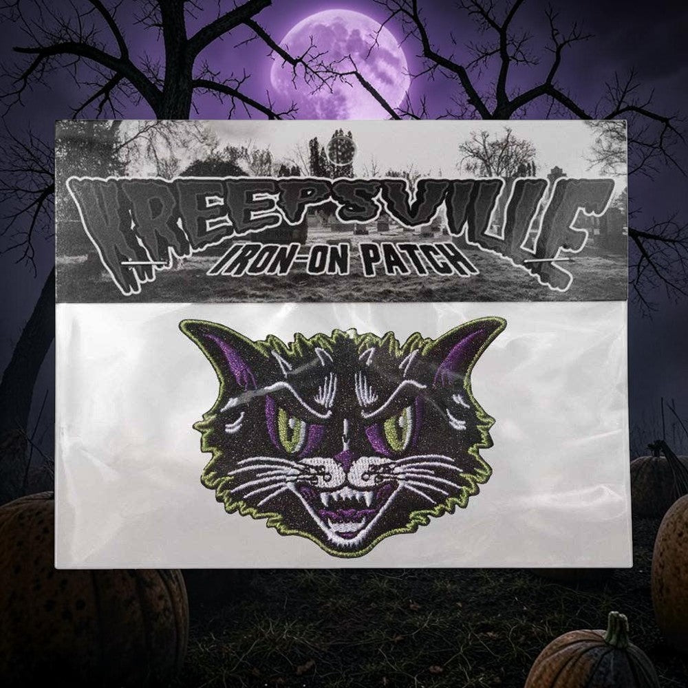 Halloween-Emporium Kattitude embroidered iron-on patch featuring a snarling black cat with purple and lime green details