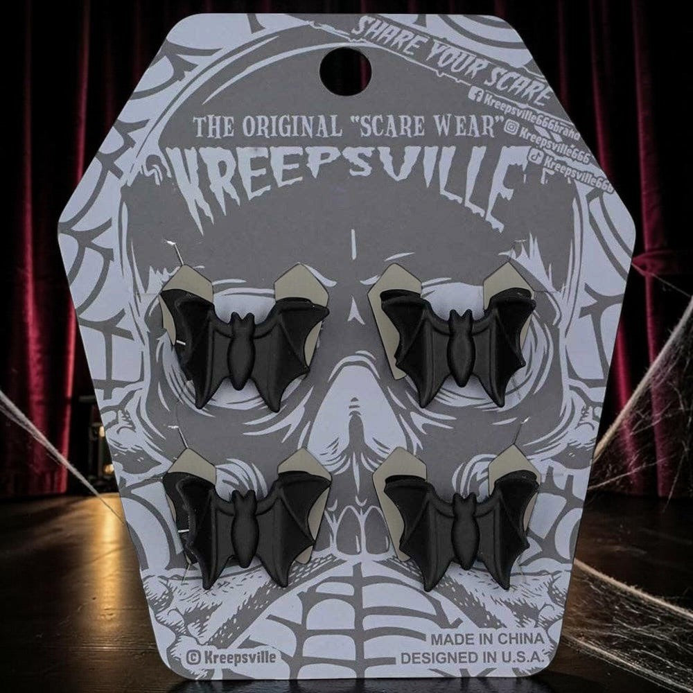 Halloween-Emporium Kreepsville set of four matte black bat hair clips on a skull-themed display card