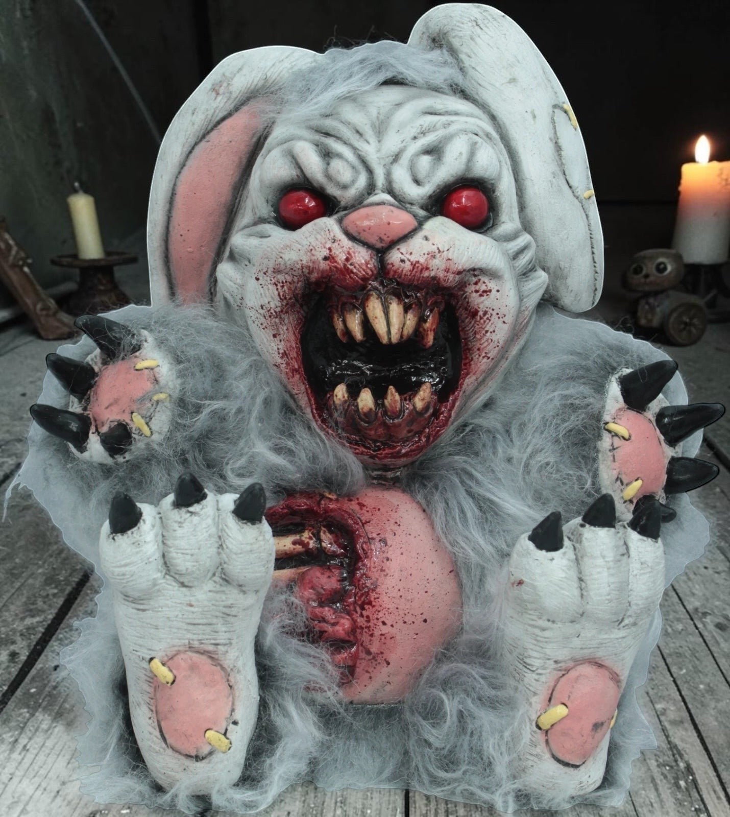 Halloween-Emporium Ghoulish Productions latex bad bunny decor with red eyes, sharp teeth, and gory chest detail.