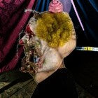 Halloween-Emporium Charles Demon of Gluttony latex clown mask with yellow hair and grotesque detail for cosplay