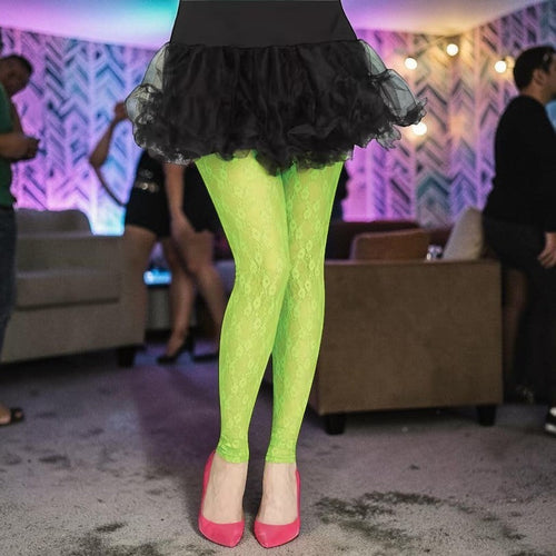 Halloween-Emporium lime green lace footless tights worn with a black tutu and pink heels at a retro party