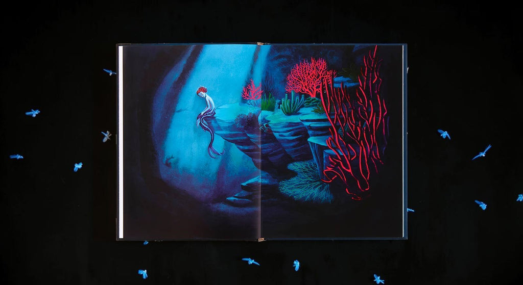 Halloween-Emporium The Little Mermaid hardcover book featuring Benjamin Lacombe's haunting blue and red underwater art