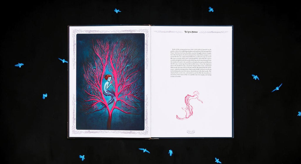 Halloween-Emporium The Little Mermaid hardcover book open to a page with haunting red coral and mermaid illustration