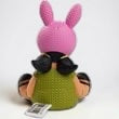 Halloween-Emporium Louise Belcher vinyl figure from Bob's Burgers, back view showing pink bunny ears and green dress.