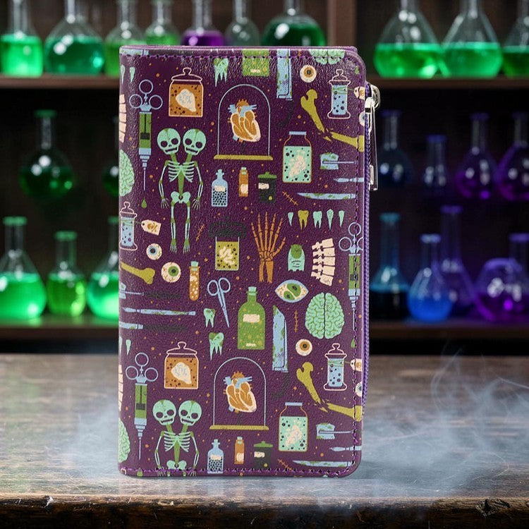 Halloween-Emporium purple vinyl wallet featuring a mad scientist print with skeletons, organs, and lab equipment.