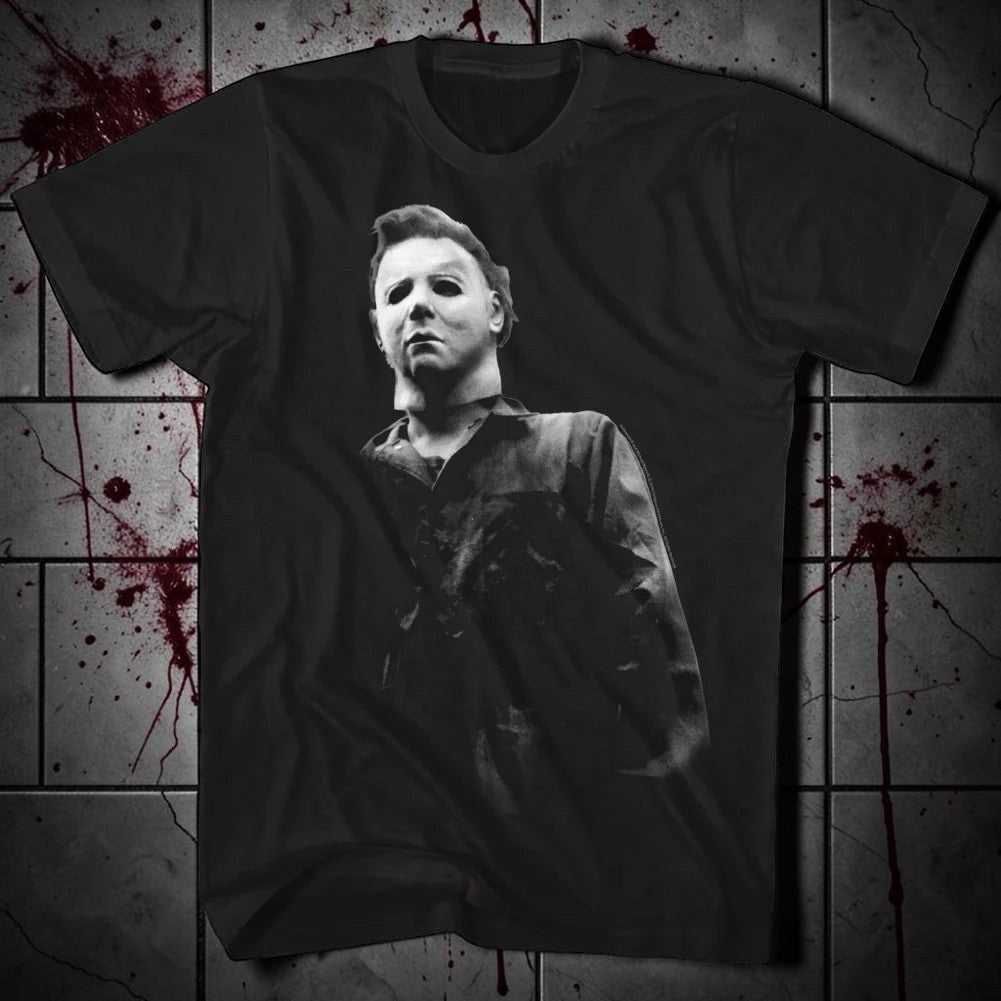 Halloween-Emporium black cotton t-shirt featuring a detailed black-and-white Michael Myers graphic from Halloween.