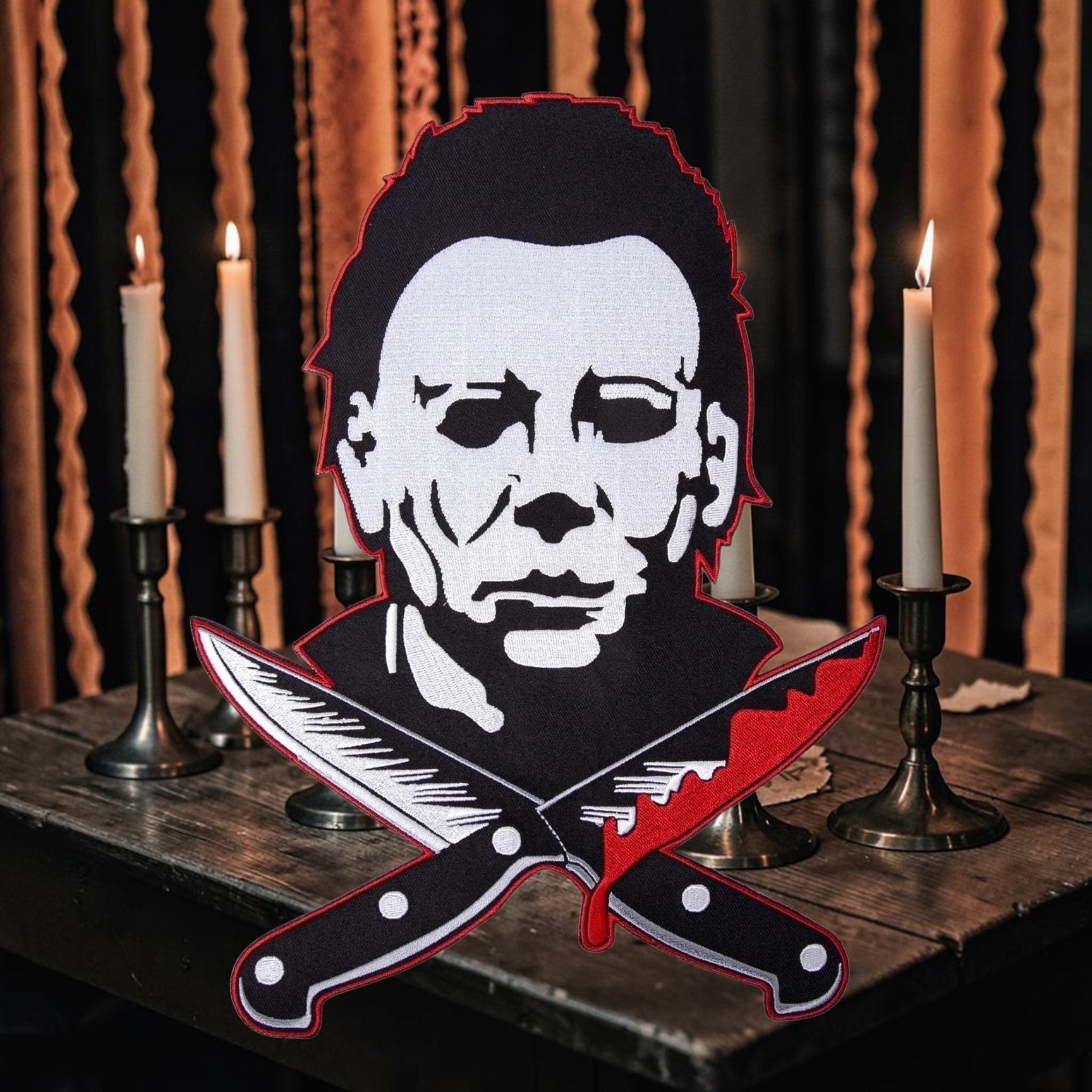 Halloween-Emporium 4-inch Michael Myers horror sticker featuring the iconic slasher mask and crossed bloodied knives.