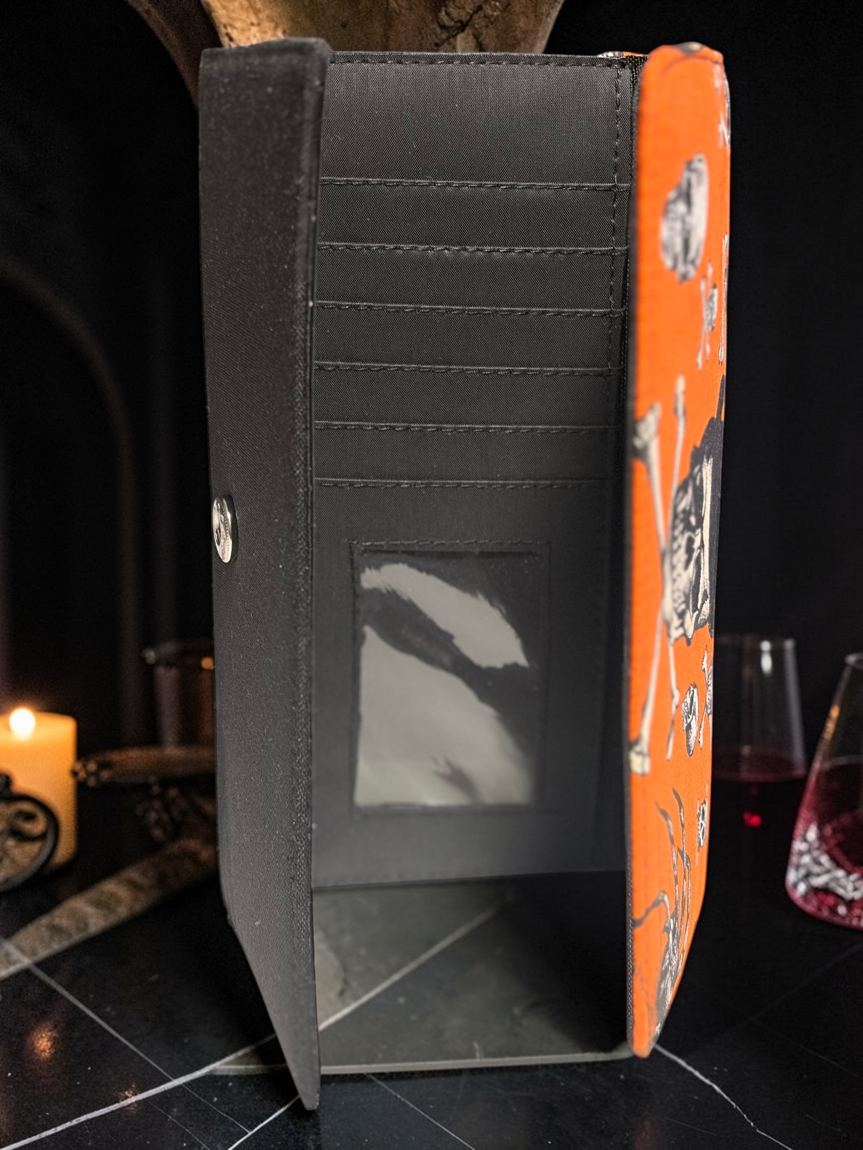 Halloween-Emporium Mummy Clutch Wallet interior showing card slots and ID window with orange skull print exterior