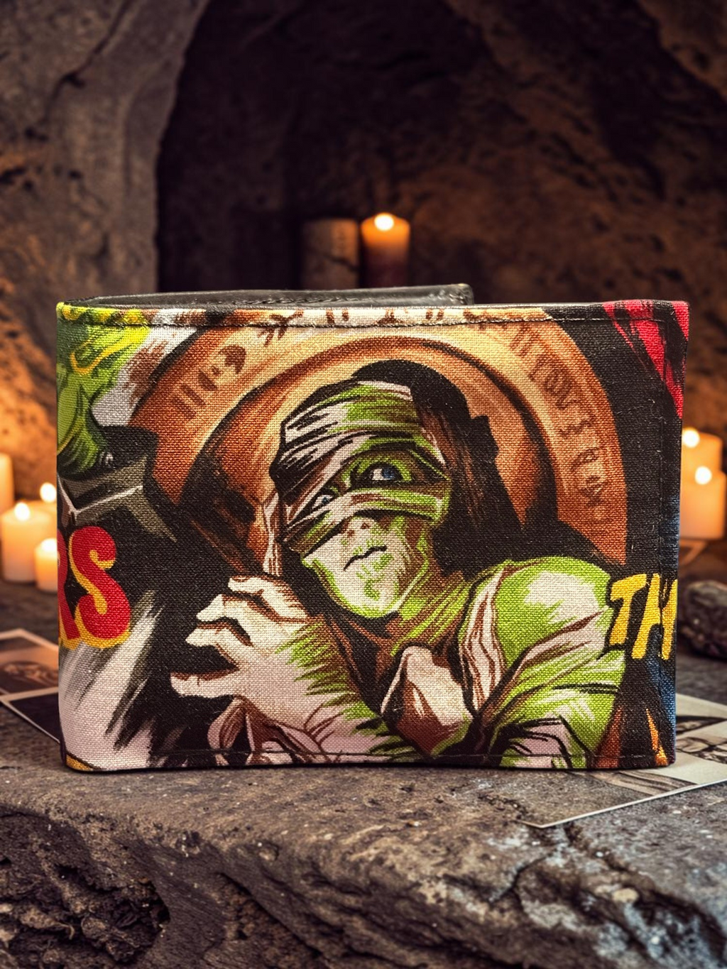 Halloween-Emporium hand crafted wallet featuring a vibrant mummy graphic print on a textured fabric surface