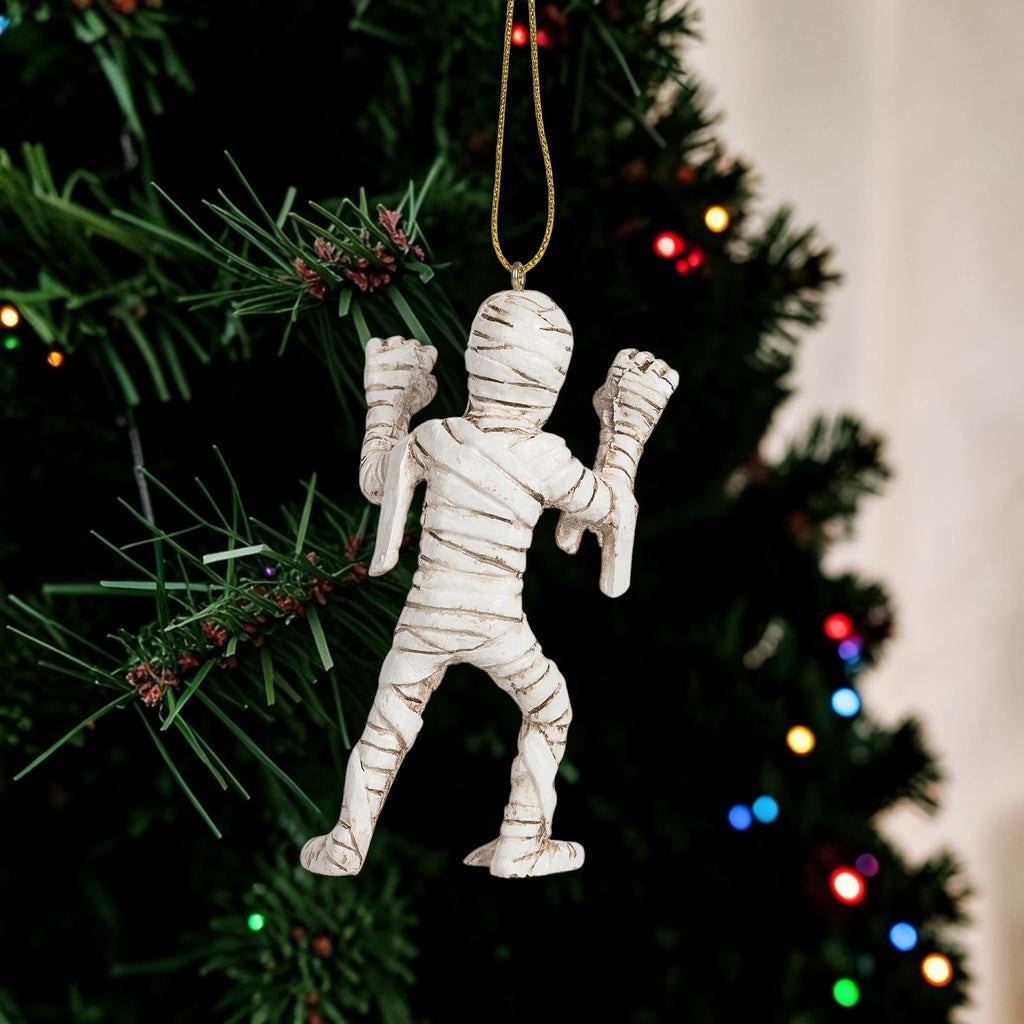 Halloween-Emporium mummy hanging ornament with detailed white bandages on a Christmas tree
