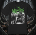 Halloween-Emporium black cotton crewneck t-shirt featuring a Munsters graphic with the Munster Koach and mansion.