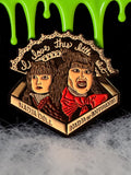 Halloween-Emporium enamel pin featuring Nadja and her doll from What We Do in the Shadows with gothic text detail.