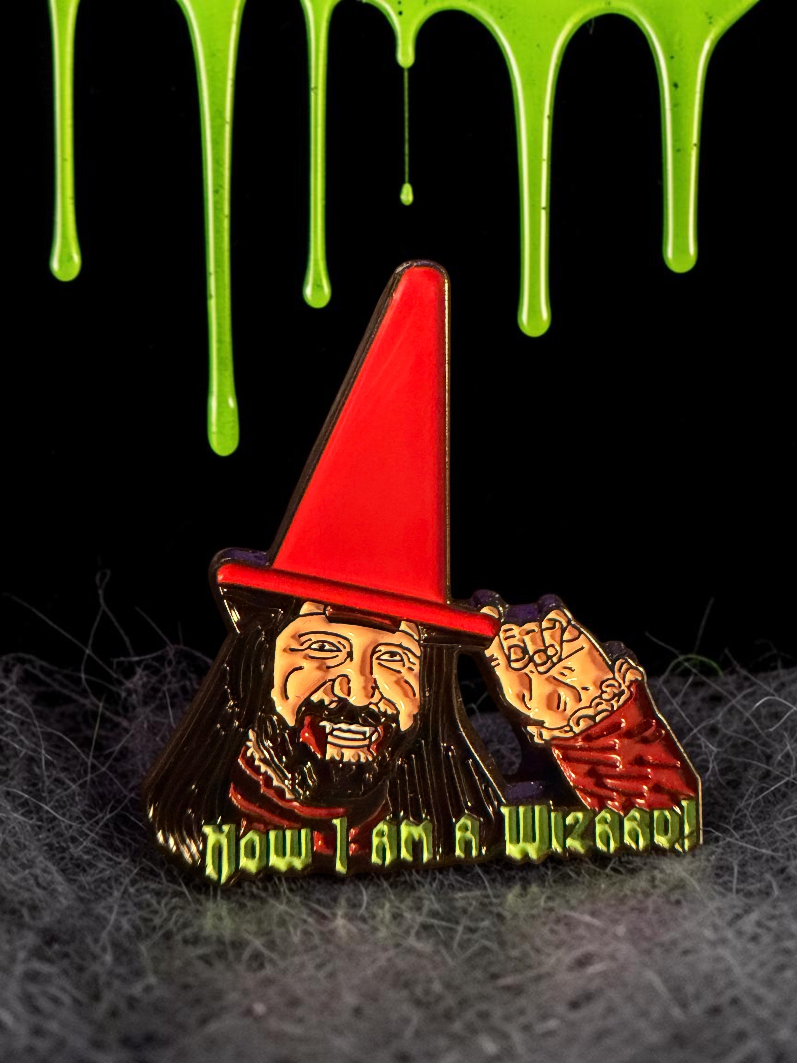 Halloween-Emporium Nando the Relentless enamel pin featuring a vampire in a red wizard hat with text Now I am a Wizard