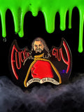 Halloween-Emporium Nandor the Relentless enamel pin featuring red and gold details against a spooky green slime background