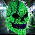 Halloween-Emporium neon green monster skull latex mask with fangs and glowing effect for Halloween costumes