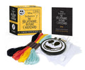 Halloween-Emporium Disney Nightmare Before Christmas cross-stitch kit with embroidery hoop, thread, and pattern book.