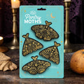 Halloween-Emporium Pantry Moths bag clips featuring four black moth-shaped clips with intricate gold celestial patterns.