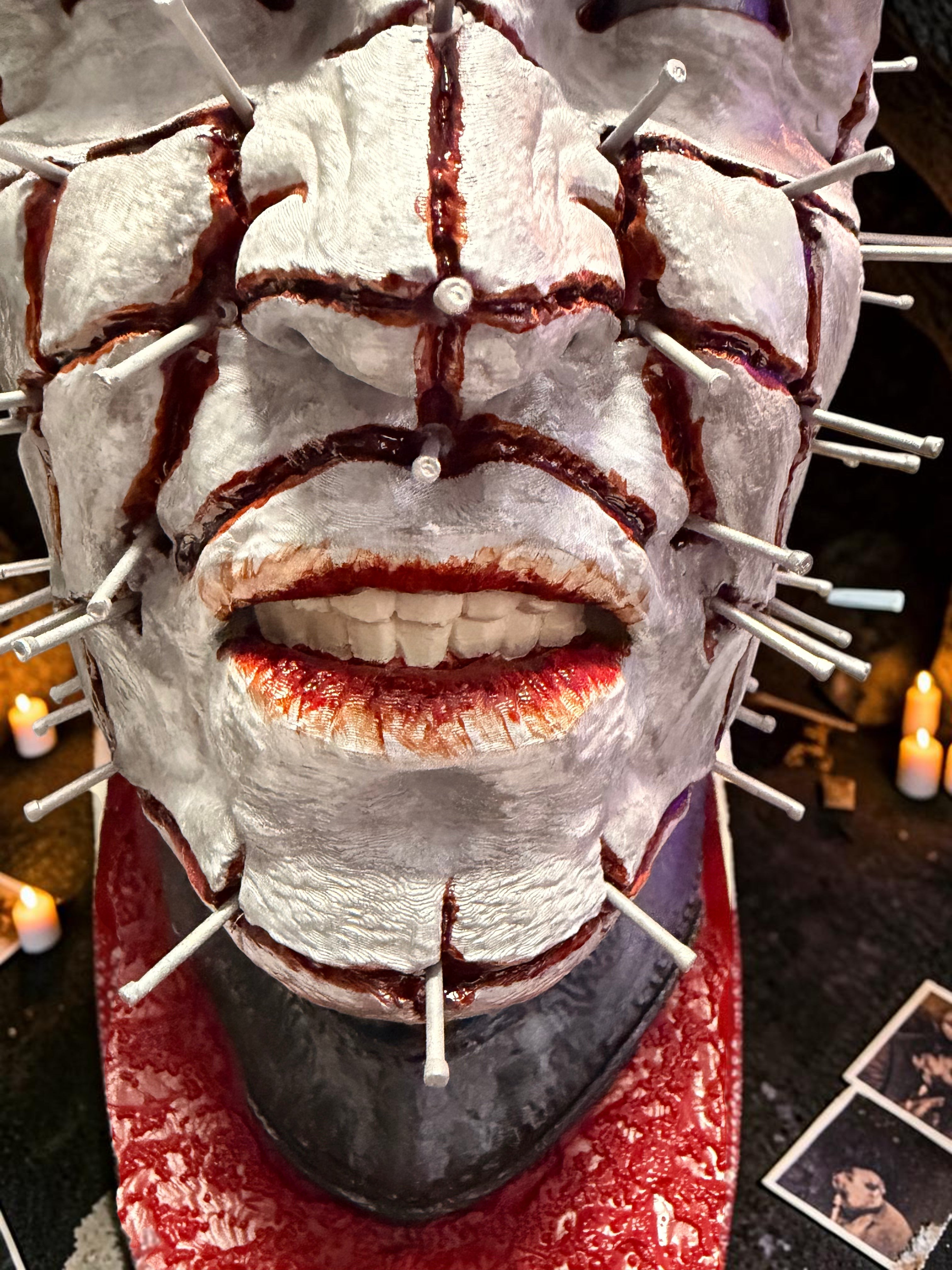 Halloween-Emporium hand painted Pinhead bust with realistic blood effects, metal pins, and textured base detail.