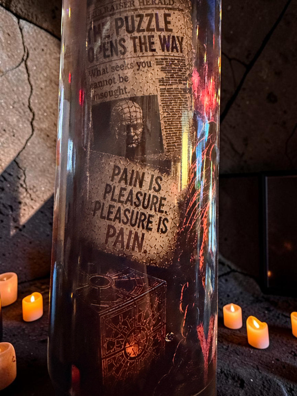 Halloween-Emporium 30oz Pinhead tumbler featuring Hellraiser graphics, text, and a puzzle box design in a dark setting.