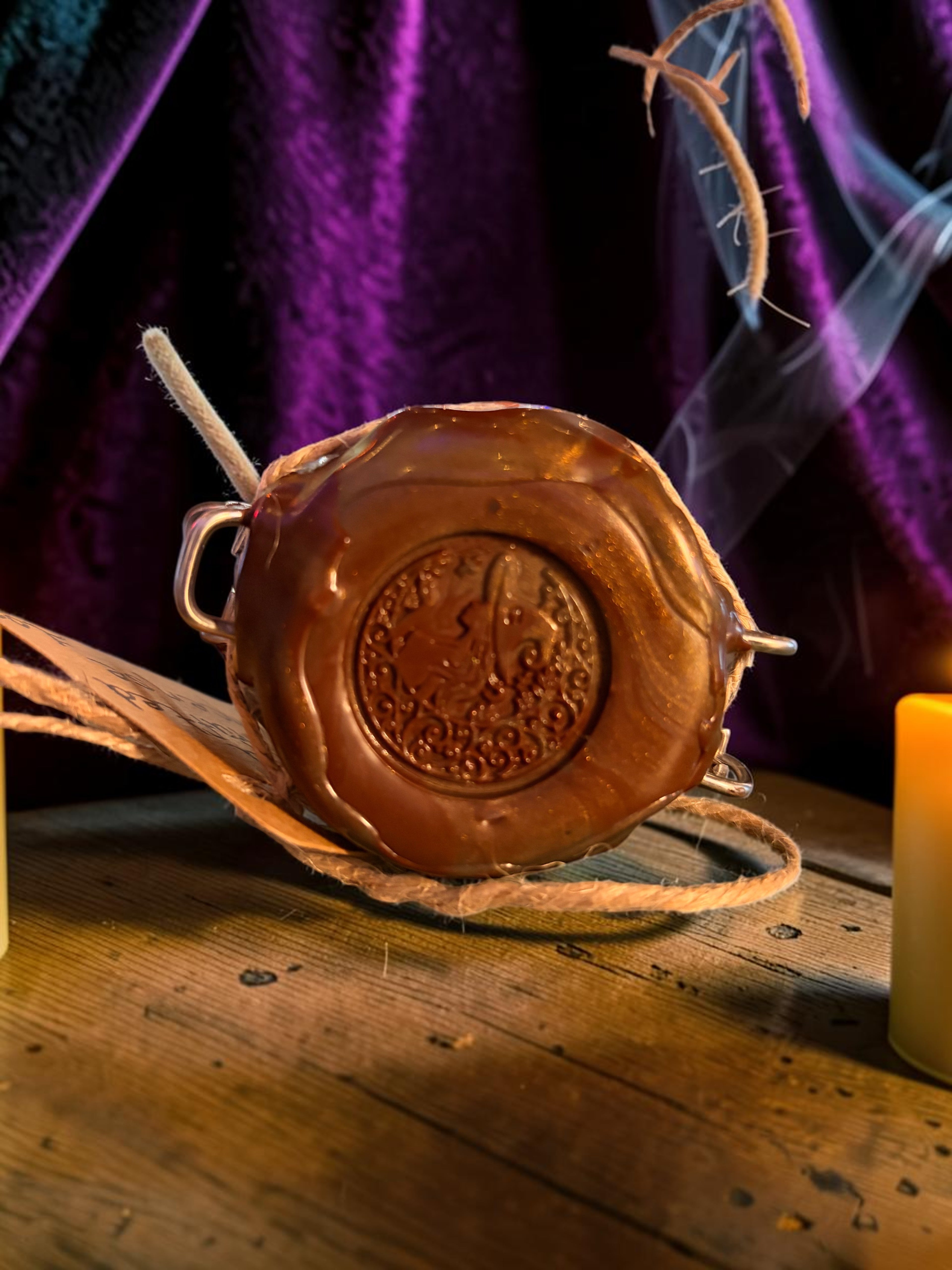 Halloween-Emporium Prosperity and Protection incense blend with a wax seal on a rustic wooden table